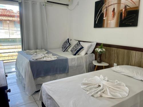 En eller flere senge i et værelse på Pousada Campo Verde