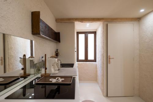 a bathroom with a sink and a toilet in a room at CASA ANANTA Appartements bien-être aux portes du Verdon Refuge slow Life et sensoriel jusqu à 12 pers in La Garde