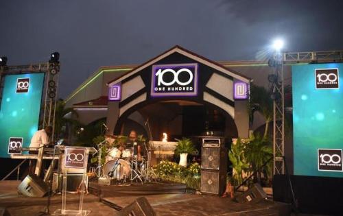 a stage with a million sign on it at Pearl of The City BEACH PEARL in Kingston