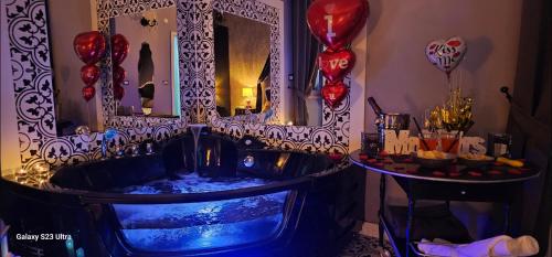 a bath tub in a room with a mirror and balloons at Anzio d'aMare in Anzio