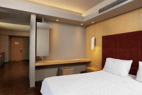 Cama o camas de una habitación en Elysion Hotel