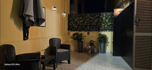 a hallway with chairs and plants in a building at Anzio d'aMare in Anzio