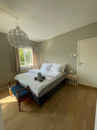 a large bed in a bedroom with a window at Hotel apartment - Oslo city center - spacious top floor apt with big private balcony in Oslo