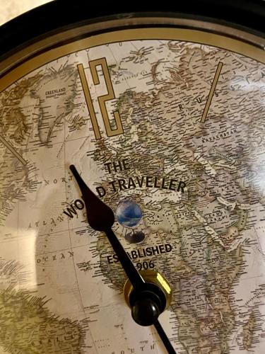 a close up of a clock with a map at Riverside Apartment in Bitola
