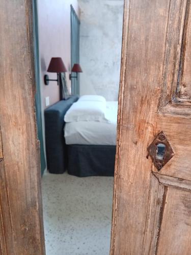 Ένα ή περισσότερα κρεβάτια σε δωμάτιο στο Dimore Arcudi