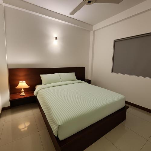 Una cama o camas en una habitación de B&M Green Valley
