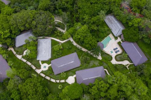 an aerial view of a house in the forest at Hotel Villa Mercedes Palenque in Palenque