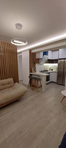 a living room with a couch and a table at departamento boutique centrico- villa carlos paz in Villa Carlos Paz