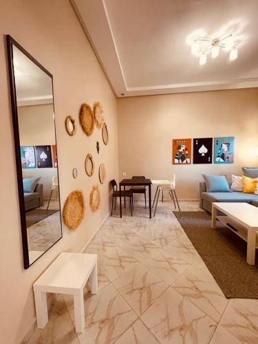 a living room with a couch and a table at Relax Family 05 in Ouarzazate