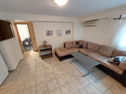 a living room with a couch and a table at Crab's Original Apartment 1 in Vrontados