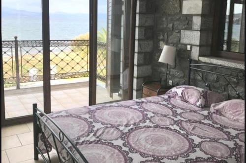 Katil atau katil-katil dalam bilik di Astros Pool & Sea Villa