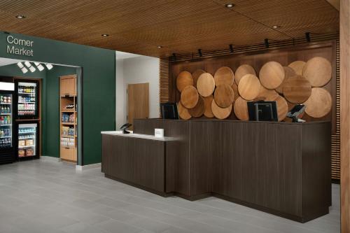 a store with a bunch of wood logs on the wall at Fairfield by Marriott Inn & Suites Portland Newberg in Newberg
