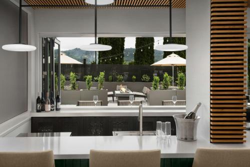 a dining room with a view of a patio at Fairfield by Marriott Inn & Suites Portland Newberg in Newberg