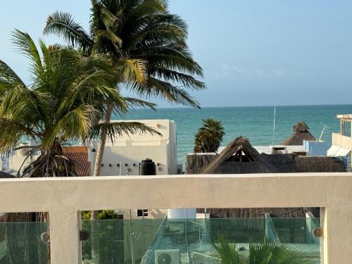 a view of the ocean from a balcony at Beach Getaway in Chuburná