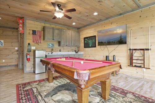 a kitchen with a pool table in a room at Dog Friendly Cabin Whot Tub, Firepit & Gameroom in Gatlinburg