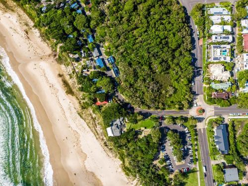 an aerial view of the beach and the ocean at Arya in Byron Bay