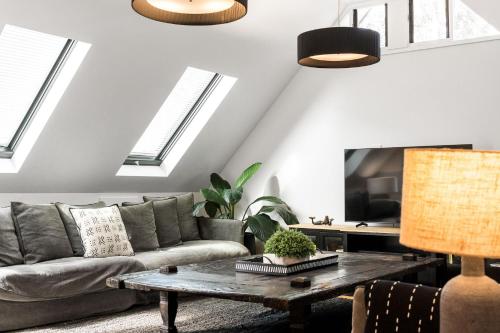 a living room with a couch and a table at A Top Spot in Byron Bay