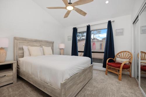 a bedroom with a large bed and a window at Tranquil Living - SUR4 in Solana Beach