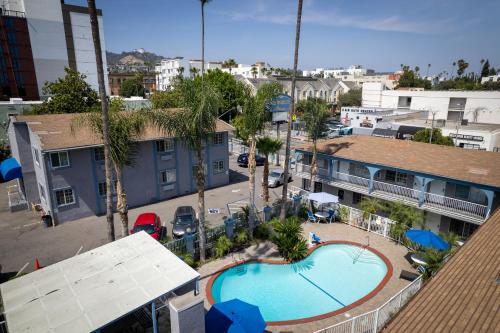 an overhead view of two swimming pools in a city at Hollywood City Inn in Los Angeles