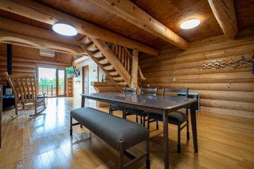 a dining room with a table and chairs at Lake Toya Moon Hills in Lake Toya