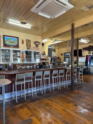 a bar in a restaurant with bar stools at Kyalite Caravan Park 