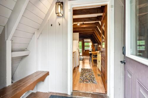 a hallway of a tiny house with a door at Camp Conway Hot Tub AC New Kitchen Deck in Conway