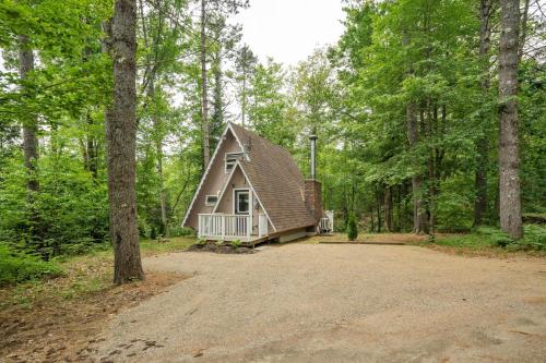 a house in the middle of a forest at Camp Conway Hot Tub AC New Kitchen Deck in Conway