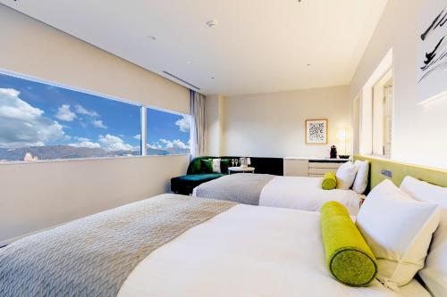 Ένα ή περισσότερα κρεβάτια σε δωμάτιο στο Hotel Nikko Himeji