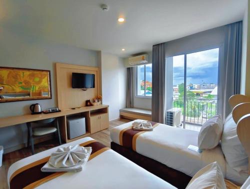 Postel nebo postele na pokoji v ubytování Bright Hotel