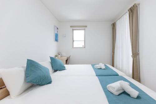 Cama o camas de una habitación en Ocean Tree