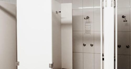 a bathroom with a shower with a glass door at BIG4 Breeze Holiday Parks - Katherine in Katherine