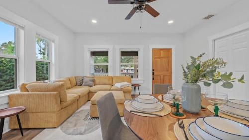 a living room with a couch and a table at Mid-Century Modern Retreat by Coffee, Food + Shops in Tampa