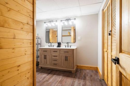 a bathroom with a sink and a mirror at Modern Cabin with Luxury Gym, Firepit + Game Room! in Blue Ridge