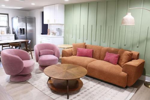 a living room with a couch and two chairs and a table at Outdoor Hangout with BBQ, Firepit, Bocce Ball and More in Tampa