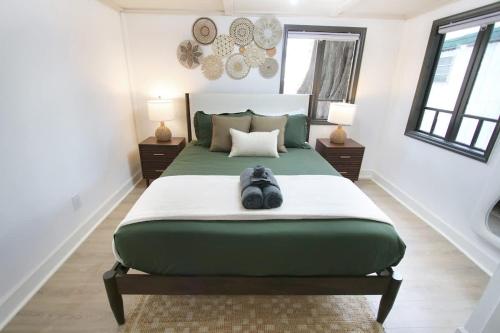 a bedroom with a large bed with a stuffed animal on it at Outdoor Hangout with BBQ, Firepit, Bocce Ball and More in Tampa
