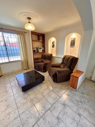 a living room with two couches and a coffee table at Casa Amplia en Ruta del vino in Ciudad Lujan de Cuyo