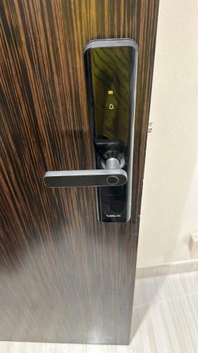 a close up of a door with a mirror on it at Damac Hills Carson studio on Golf Course in Dubai Marina