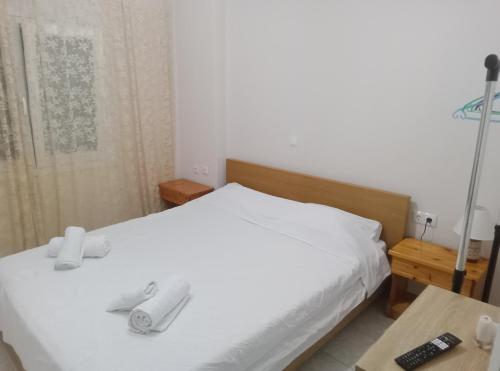 Ένα ή περισσότερα κρεβάτια σε δωμάτιο στο APARTMENT PEREA THESSALONIKI