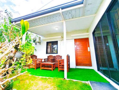 a house with a green lawn in front of it at Casa Bella 3BR Home in Capas Tarlac near New Clark City in Capas