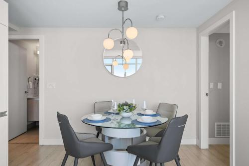 a dining room with a table and chairs at The Getaway Next to Stampede 2BR Suite Downtown in Calgary