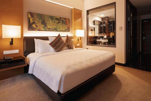 Katil atau katil-katil dalam bilik di Impiana KLCC Hotel