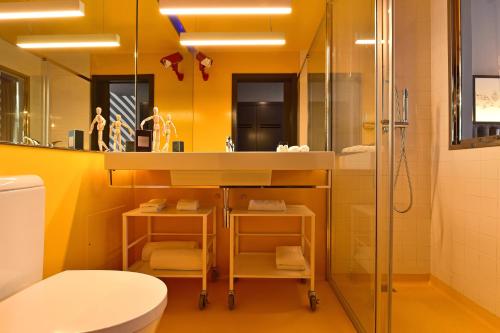 a bathroom with a sink and a shower at Pestana CR7 Funchal in Funchal