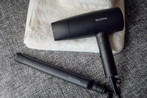 a black hair dryer sitting next to a towel at Stylish Room Near Susukino 2 Beds 205 in Sapporo