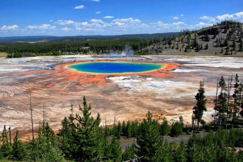 an aerial view of a erupting geyser in a field at Newly Built - The Targhee at The Basin Luxury Suites in Driggs