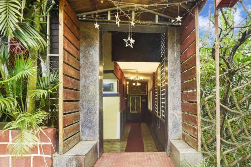 an entrance to a house with a star on the ceiling at Collection O Porvorim Near Mall De Goa in Goa