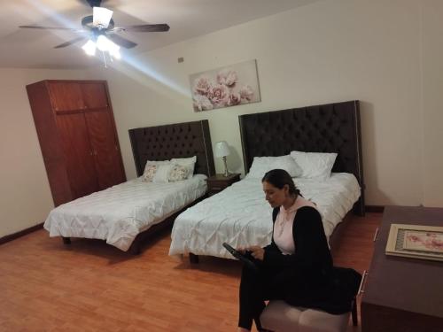 Katil atau katil-katil dalam bilik di Flor y Canto Hotel