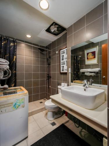 a bathroom with a sink and a toilet at La Mirada Residence, Large 1 bedroom Condo, Ocean views, Beaches, 3 pools, restaurants in Mactan