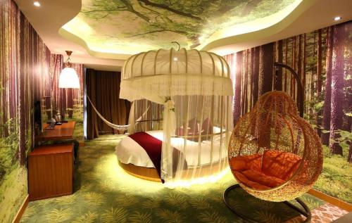 a bedroom with a bed with a swing in it at Grand Nest Hotel (Tang Jia Wan Beach) in Zhuhai