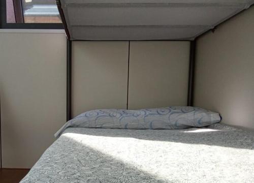 Ένα ή περισσότερα κρεβάτια σε δωμάτιο στο Coruña Backpackers Hostel