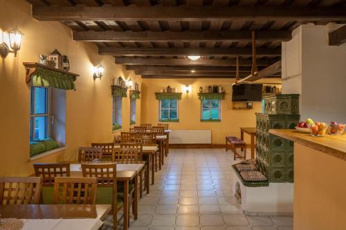 a restaurant with tables and chairs in a room at Bouda Pavlovka in Dolní Malá Úpa